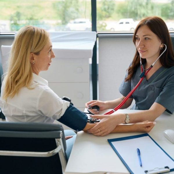 adult-woman-undergoing-routine-health-check-with-family-doctor-1024x682